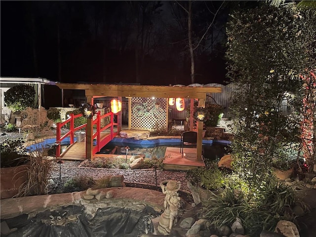 patio at twilight featuring a covered pool