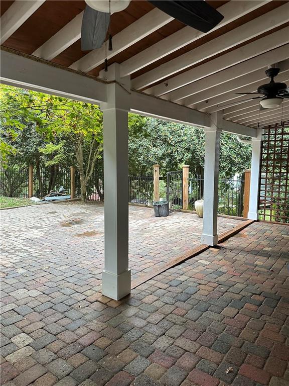 view of patio featuring ceiling fan