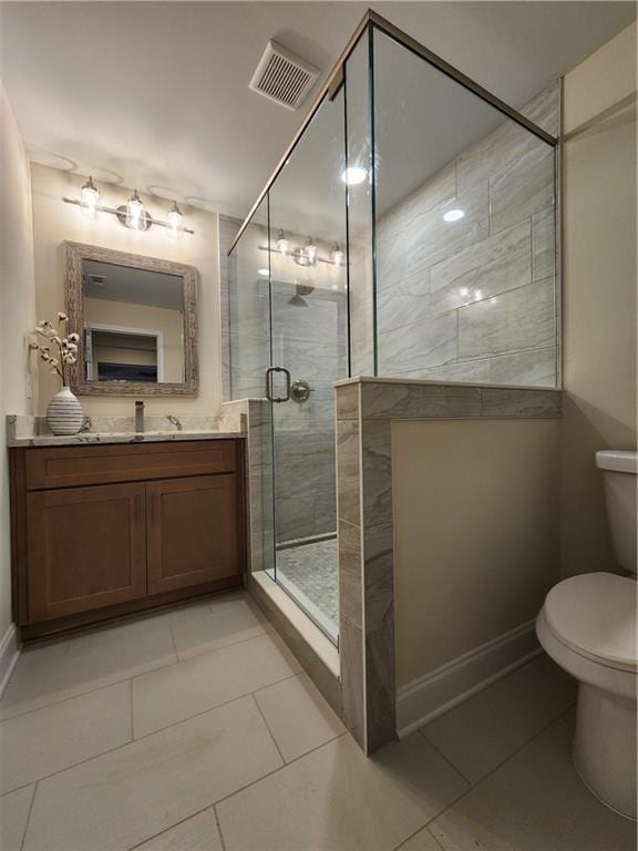 bathroom with vanity, an enclosed shower, tile patterned floors, and toilet