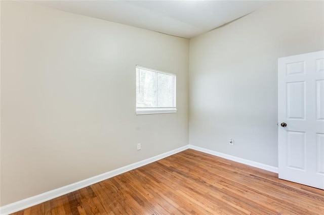 spare room featuring light hardwood / wood-style flooring