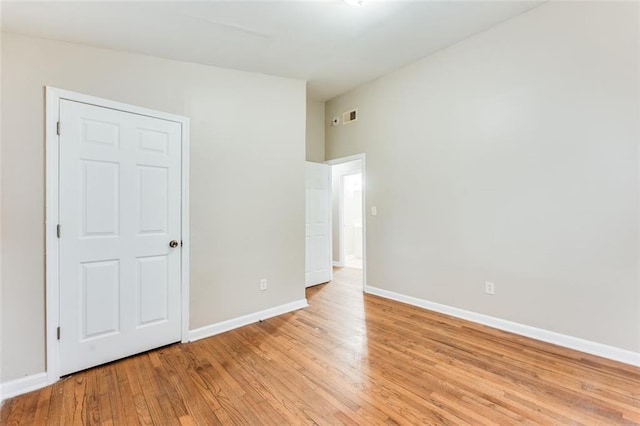 spare room with light wood-type flooring