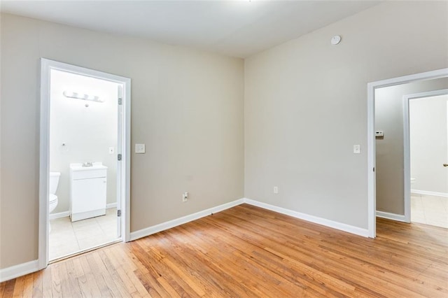 empty room with light hardwood / wood-style floors