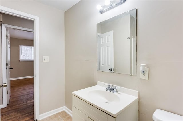 bathroom featuring vanity and toilet