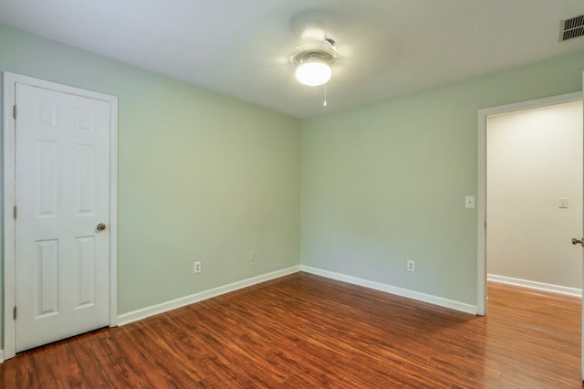 unfurnished room featuring hardwood / wood-style floors and ceiling fan