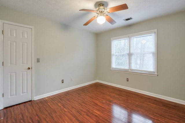 unfurnished room featuring ceiling fan and hardwood / wood-style floors