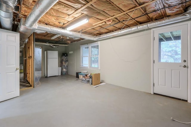 basement with white fridge