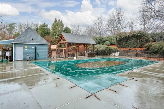 exterior space featuring a community pool and a gazebo