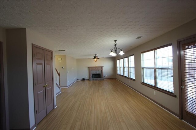 spare room with baseboards, french doors, carpet, and a notable chandelier