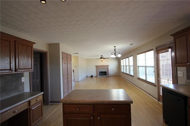 carpeted empty room featuring a chandelier, a textured ceiling, visible vents, and baseboards