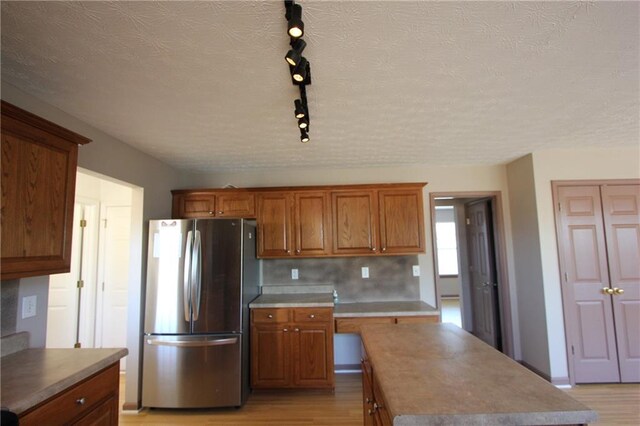 kitchen featuring black appliances, light countertops, a sink, and visible vents