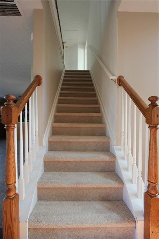 staircase with visible vents