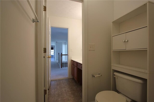 full bath featuring toilet, tile patterned flooring, and washtub / shower combination