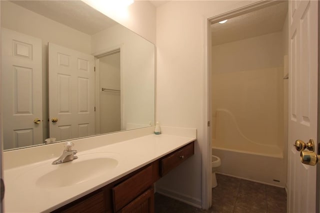 full bathroom featuring shower / bathtub combination, toilet, a textured ceiling, vanity, and tile patterned floors