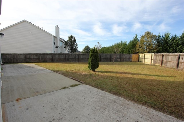 view of yard with a fenced backyard