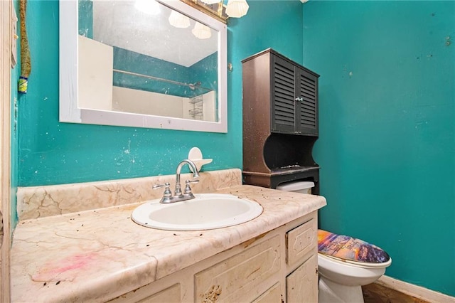 bathroom featuring vanity and toilet