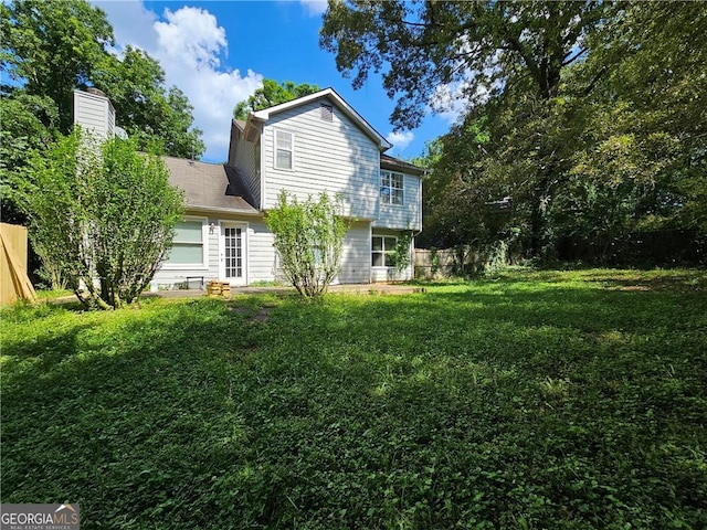 exterior space featuring a garage and fence