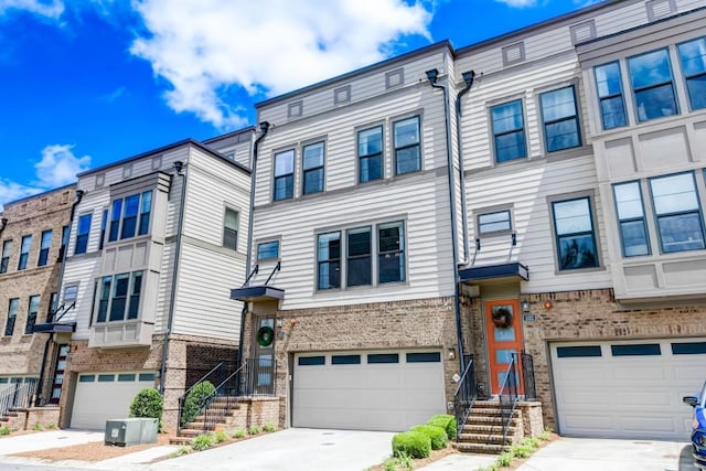 multi unit property featuring a garage