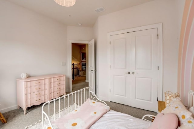 bedroom with light carpet and a closet