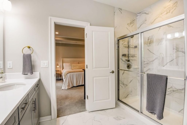 bathroom with vanity and a shower with shower door