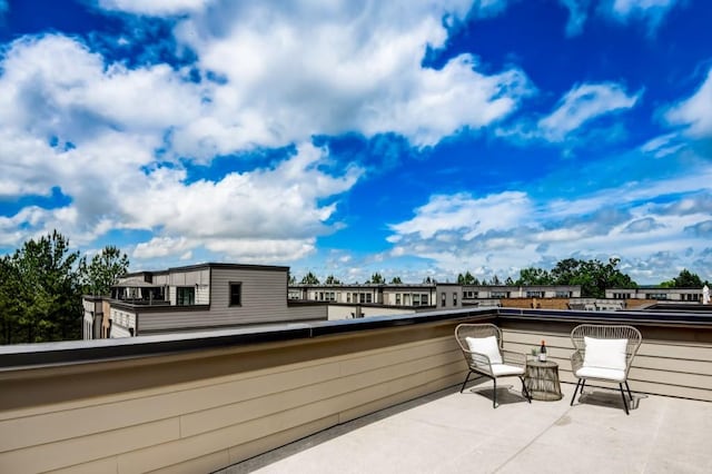 view of patio featuring a balcony