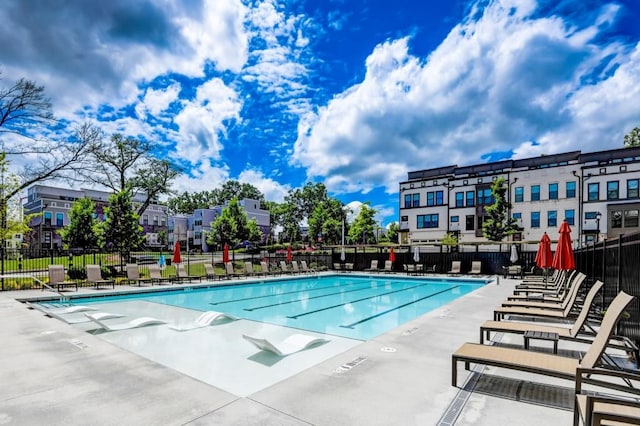 view of swimming pool with a patio