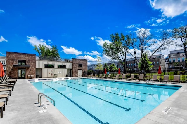 view of swimming pool featuring a patio area