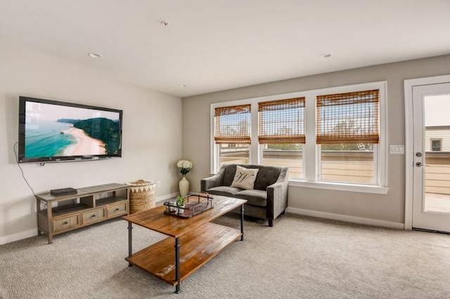 living room featuring light carpet