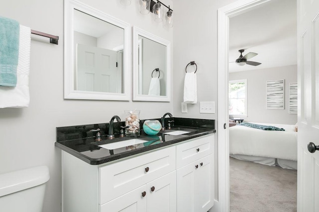 full bathroom with ensuite bathroom, a sink, toilet, and ceiling fan