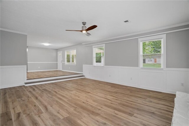 46 Forkwood Cir, Hiram, GA 30141 - spare room featuring visible vents, wood finished floors, a ceiling fan, and wainscoting