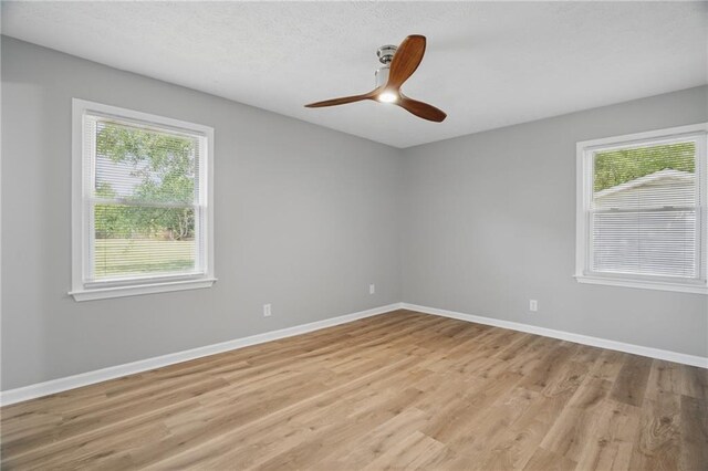 46 Forkwood Cir, Hiram, GA 30141 - spare room featuring ceiling fan, baseboards, and light wood-style floors