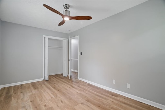 46 Forkwood Cir, Hiram, GA 30141 - unfurnished bedroom with a closet, a ceiling fan, light wood-style flooring, and baseboards
