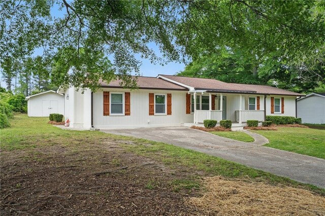 46 Forkwood Cir, Hiram, GA 30141 - ranch-style house with covered porch, driveway, and a front yard