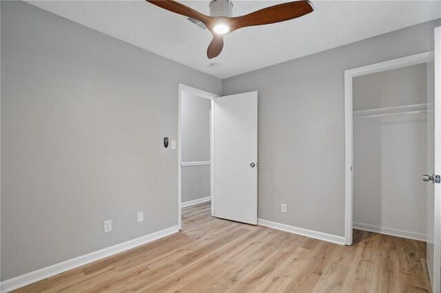 46 Forkwood Cir, Hiram, GA 30141 - unfurnished bedroom featuring baseboards, light wood-type flooring, a ceiling fan, and a closet