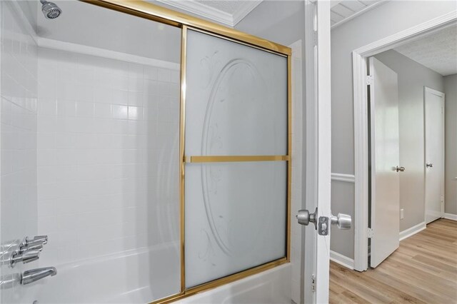 46 Forkwood Cir, Hiram, GA 30141 - bathroom with bath / shower combo with glass door, wood finished floors, and baseboards