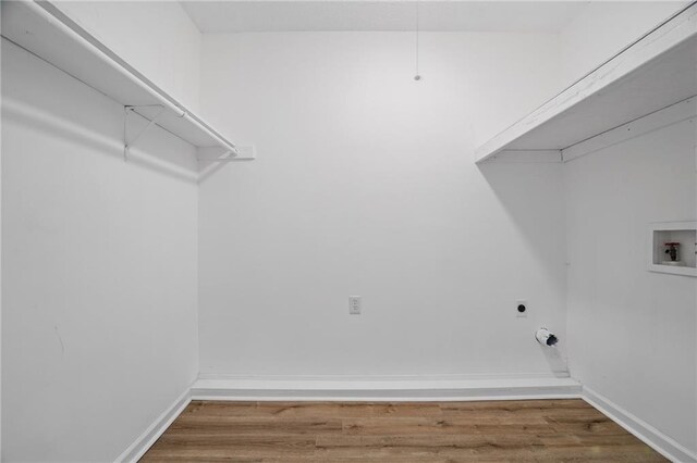 46 Forkwood Cir, Hiram, GA 30141 - laundry room with washer hookup, electric dryer hookup, baseboards, wood finished floors, and laundry area