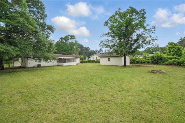 46 Forkwood Cir, Hiram, GA 30141 - view of yard featuring an outdoor fire pit