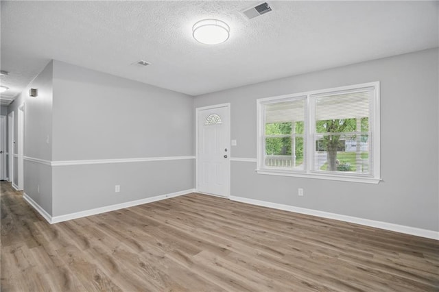 46 Forkwood Cir, Hiram, GA 30141 - unfurnished room featuring a textured ceiling, visible vents, wood finished floors, and baseboards