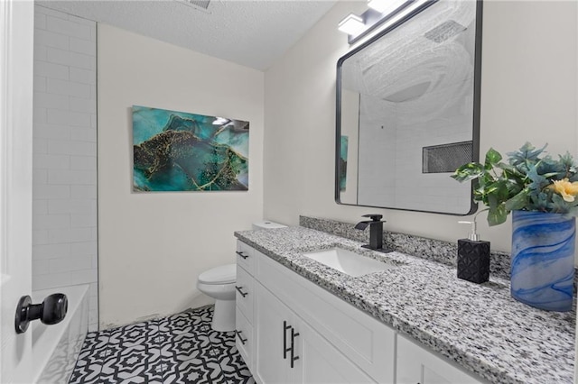 4701 Flat Shoals Rd Unit 56E, Union City, GA 30291 - full bathroom with shower / bathing tub combination, vanity, tile patterned flooring, toilet, and a textured ceiling