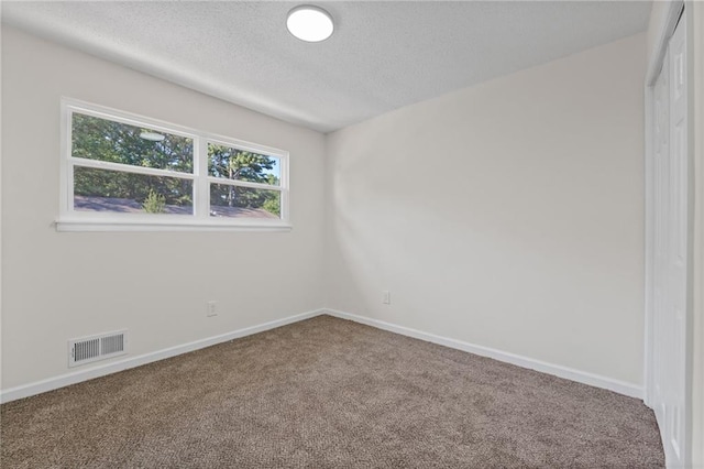 4701 Flat Shoals Rd Unit 56E, Union City, GA 30291 - unfurnished room featuring carpet flooring and a textured ceiling