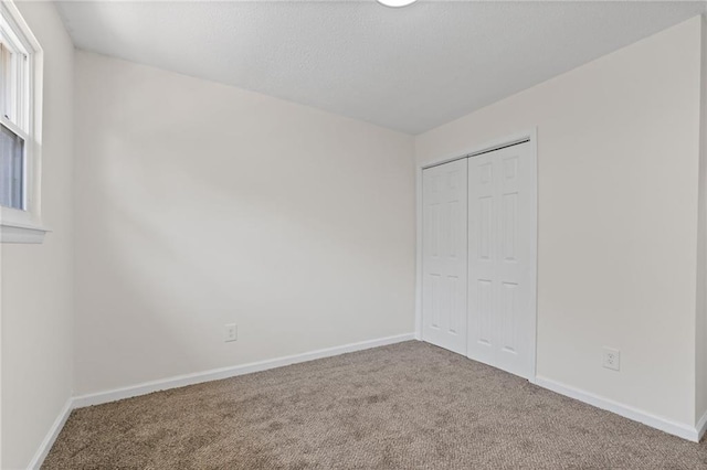 4701 Flat Shoals Rd Unit 56E, Union City, GA 30291 - unfurnished bedroom featuring carpet flooring and a closet