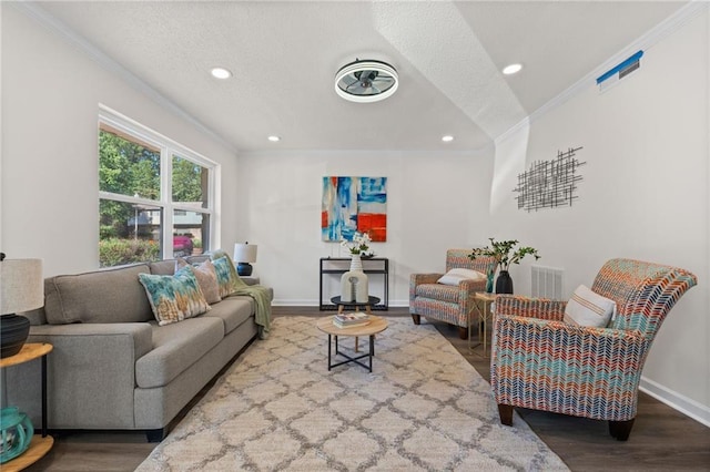 4701 Flat Shoals Rd Unit 56E, Union City, GA 30291 - living room featuring a textured ceiling, hardwood / wood-style flooring, and crown molding
