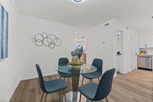 4701 Flat Shoals Rd Unit 56E, Union City, GA 30291 - dining room with a textured ceiling, light hardwood / wood-style flooring, and crown molding