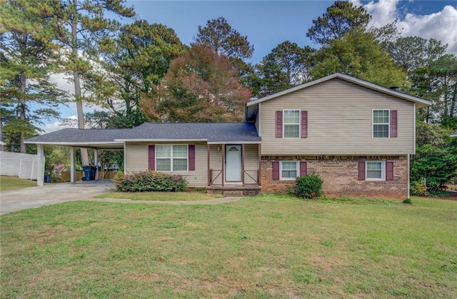 tri-level home with a carport and a front lawn