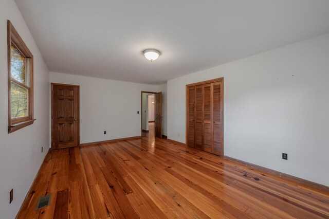 spare room with light wood-type flooring