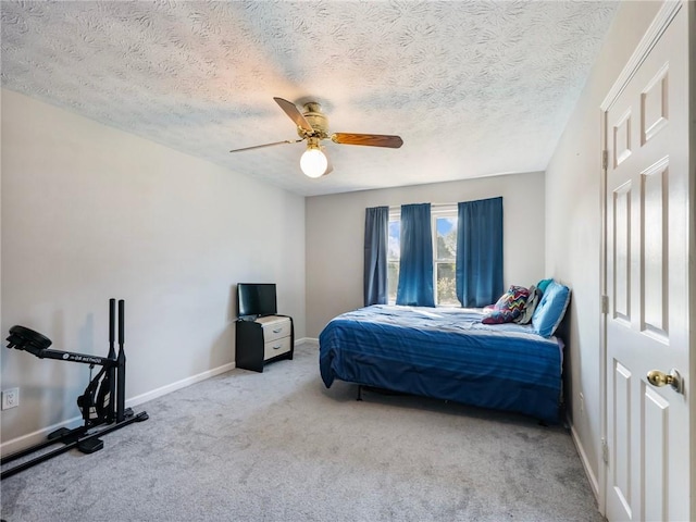 443 Rhett Dr, Loganville, GA 30052 - carpeted bedroom with a ceiling fan and a textured ceiling