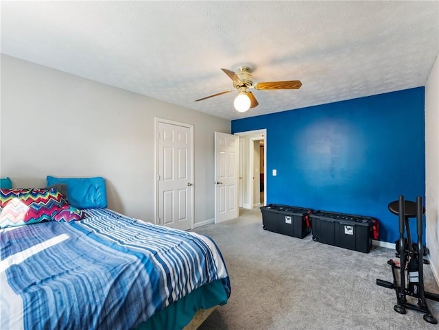 443 Rhett Dr, Loganville, GA 30052 - bedroom featuring carpet, ceiling fan, and a textured ceiling