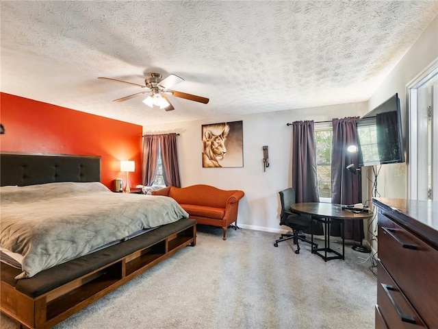 443 Rhett Dr, Loganville, GA 30052 - carpeted bedroom with a textured ceiling and ceiling fan