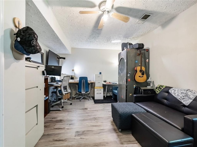 443 Rhett Dr, Loganville, GA 30052 - office with a textured ceiling, wood finished floors, and ceiling fan