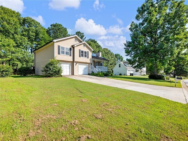 443 Rhett Dr, Loganville, GA 30052 - split level home featuring driveway, an attached garage, and a front yard