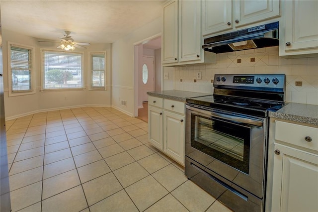 kitchen with backsplash, ceiling fan, stainless steel range with electric cooktop, and light tile patterned flooring